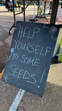 A blackboard with white writing - Help Yourself to some seeds