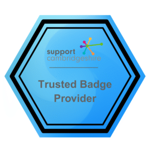 Hexagon-shaped blue badge with the Support Cambridgeshire logo at the top and the words “Trusted Badge Provider” in the centre.