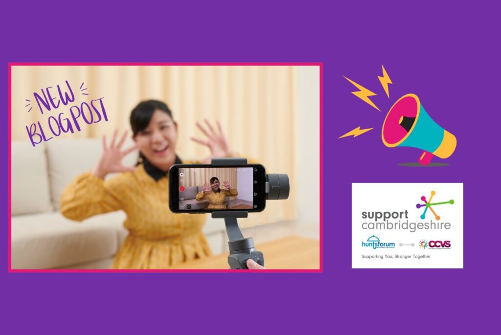 Purple background. We see a photo of someone wearing a yellow dress in front of a smart phone camera, they have their hands up waving and are smiling. We see the phone being held by a gimbal. We also see the Support Cambridgeshire interim logo and a graphic of a loud hailer. Text reads: Lights, Camera, Impact. How Charities Can Use Video and Storytelling to Connect and Inspire. New blogpost.